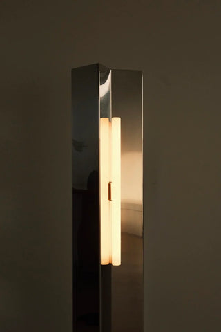 Close-up of the the Arrow floor lamp in stainless steel by Violaine D'harcourt 