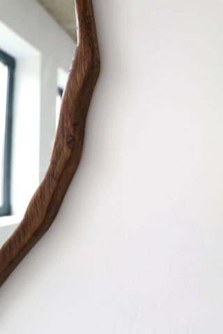 close-up on dark wood mirror